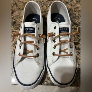 Sperry Pier View Core white shoes with brown leather laces.